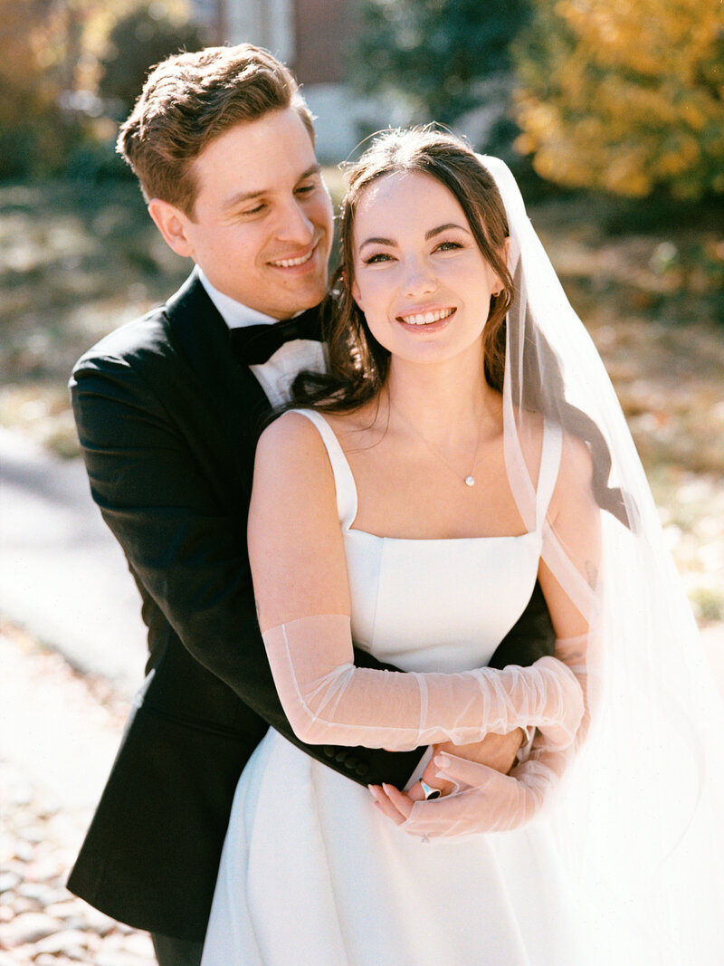 Bride & groom kiss on Philadelphia street corner