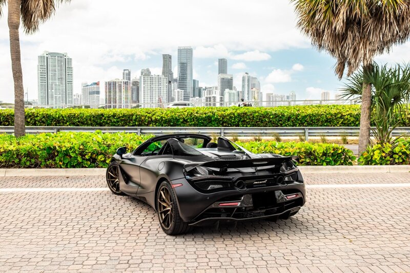mclaren-720s-spider-convertible-black-for-rent-in-miami-rear-quarter-view-010