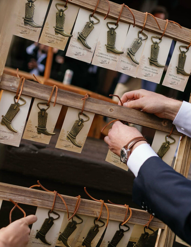 cowboy-boot-bottle-holder-escort-cards-for-colorado-wedding-by-@wedluxecreative-for-@ gobelladesign
