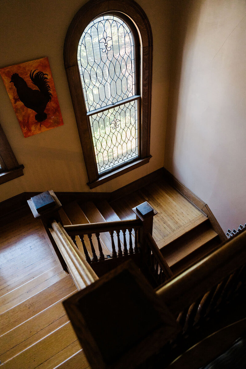 window and wooden staircase in old historic house