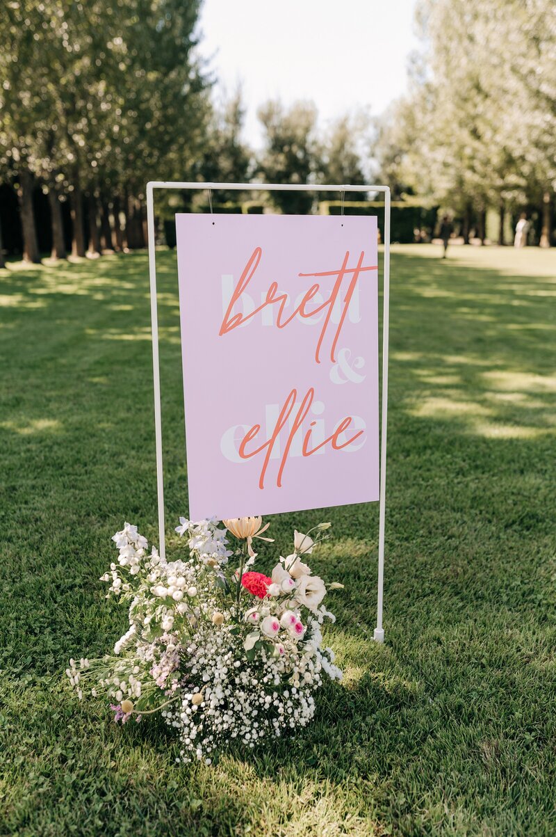 with this sign chritschurch red and pink wedding sign on lawn for ceremony christchurch nz