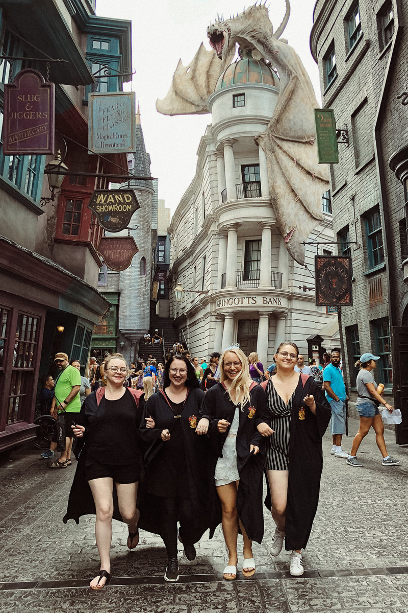 bride and bridesmaids in harry potter world for bachelorette party