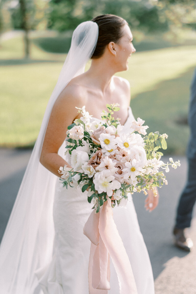 Bride and groom walk up memorial steps at their DC wedding