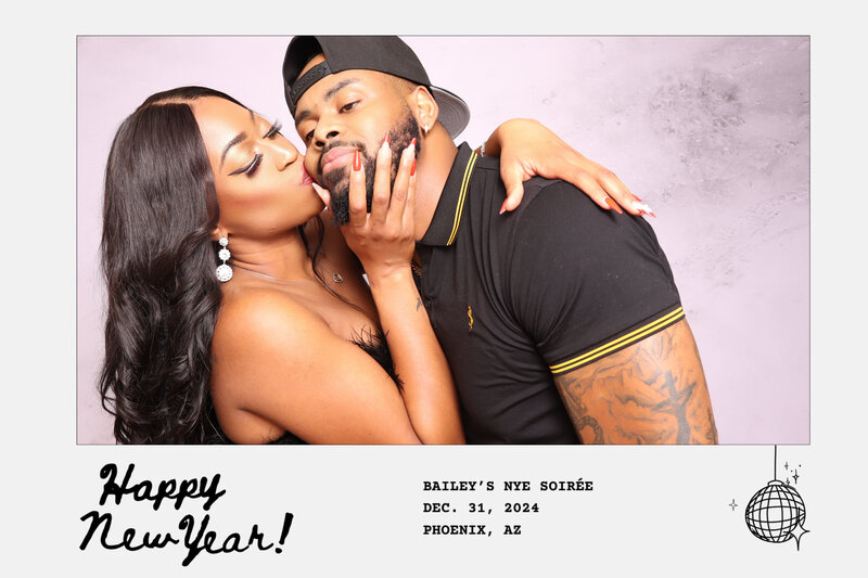 Sweet moment as woman kisses her partner on the cheek in Always Present photo booth.