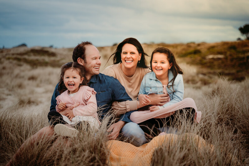 Family with baby in the dunes at Mount Maunganui Beach
