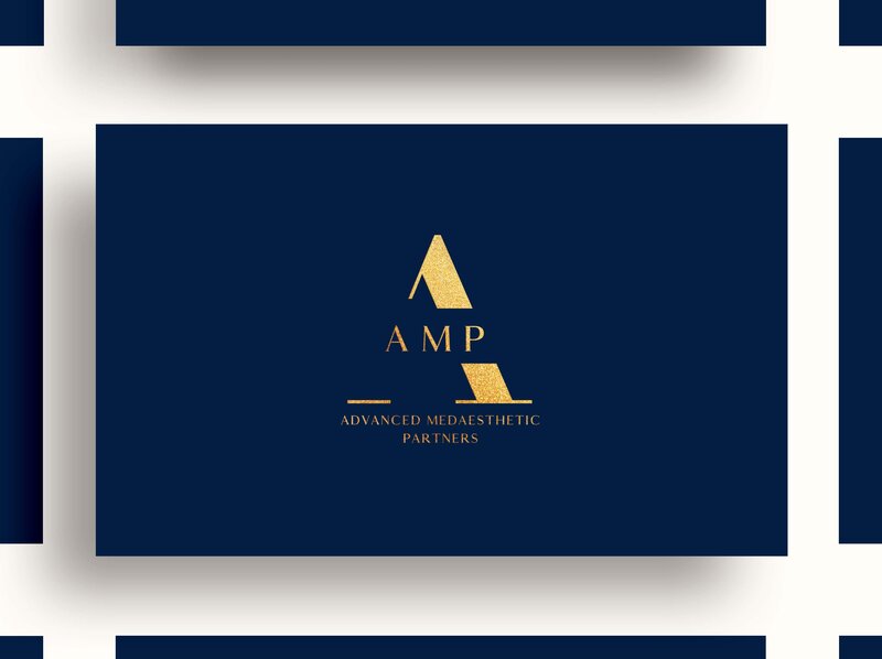 AMP logo on blue paper
