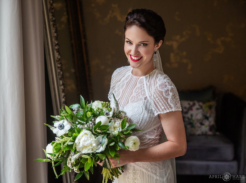 Bride Portrait with pretty bouquet in the Bridal suite at Blackstone Rivers Ranch in Idaho Springs