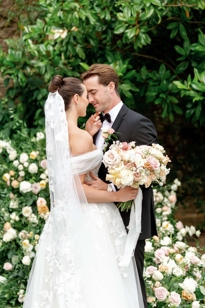 Married couple standing in a garden at Euridge Manor
