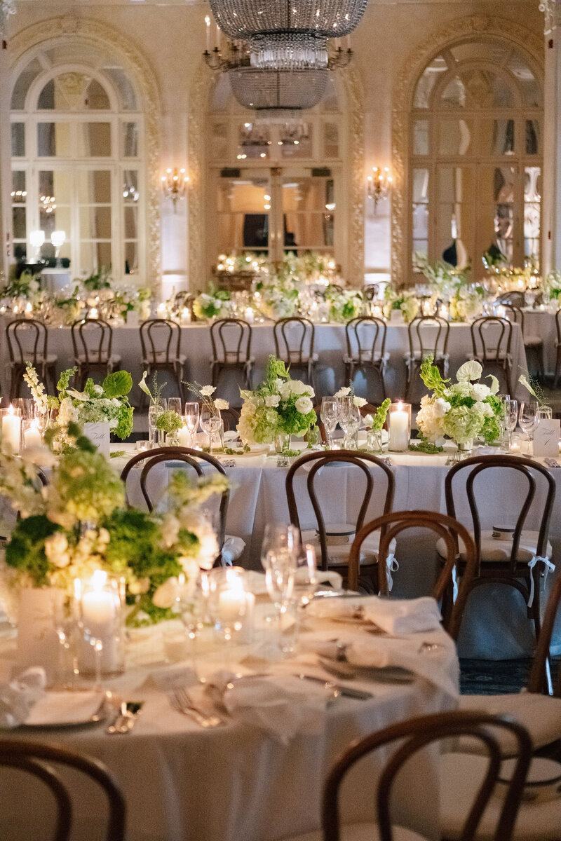 Newlyweds Dom and Grace share a kiss at their wedding, surrounded by guests cheering and holding floral bouquets.