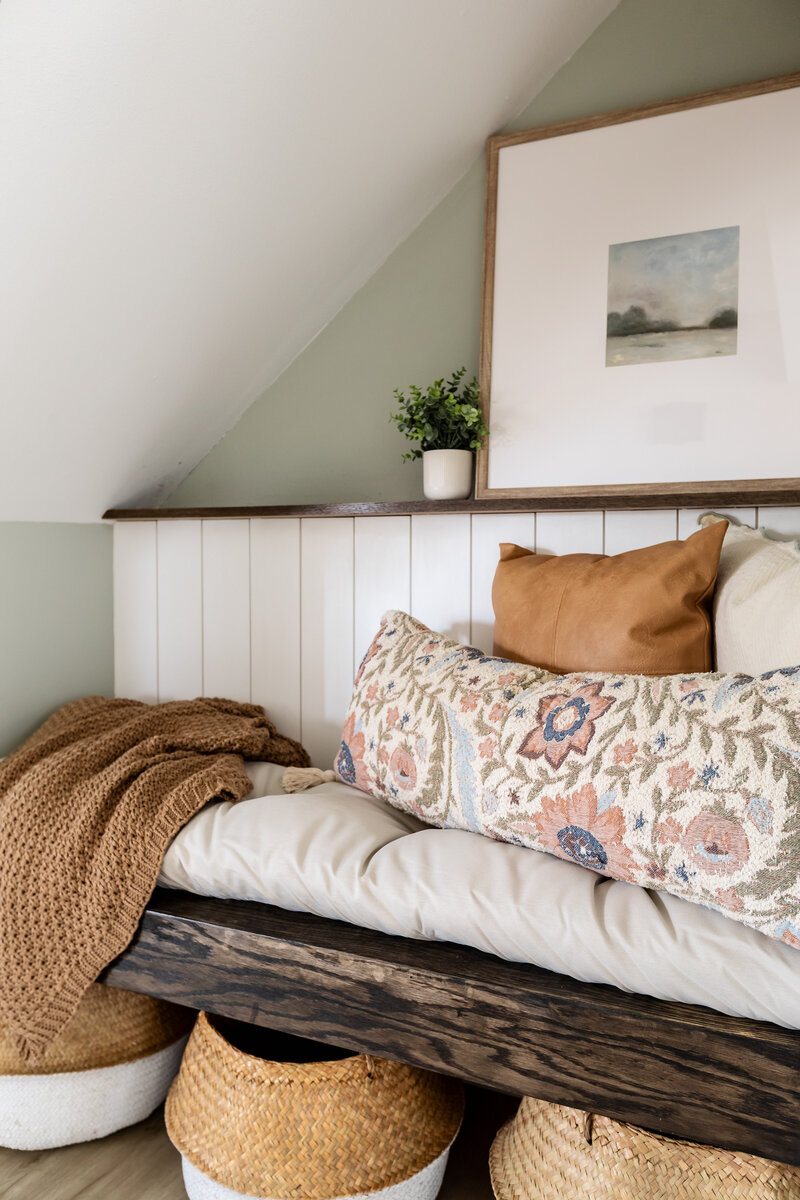 Under stair storage nook with bench, cushions and shelving