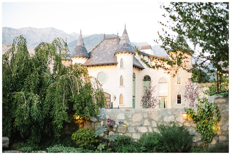 The Elegant Castle In Lindon Utah with white stones and turrets with Mount Timpanogos in the background