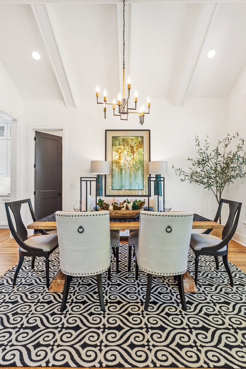dining room design with black and gold chandelier