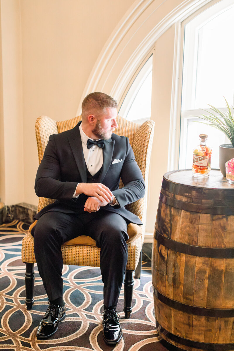 dapper groom portraits at a hotel