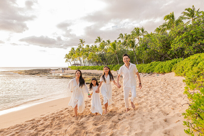 Hawaii beach family photoshoot capturing candid moments - professional vacation photographers creating authentic memories