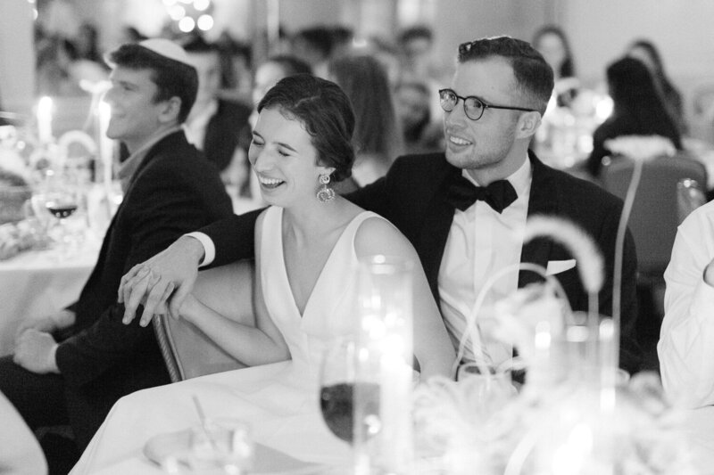 Couple laughing at wedding reception