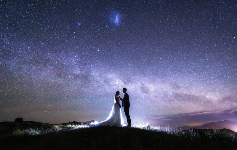 A couple eloping at night in Queenstown on a starry night