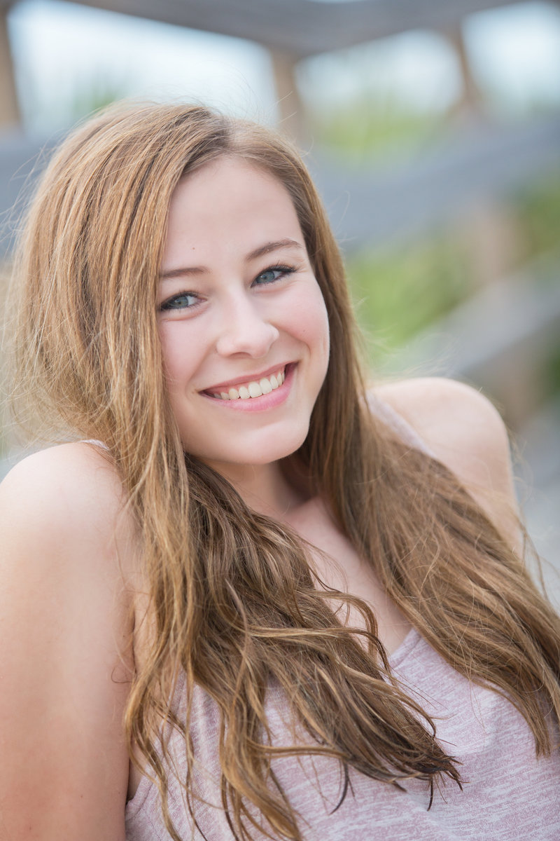 Girls with red hair smiling at camera for Orlando Graduation Photography session