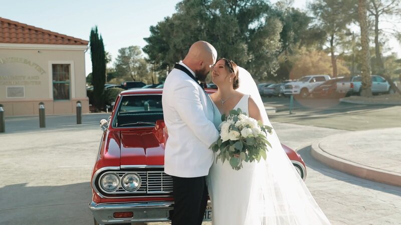 Newlyweds sharing a kiss , documented by Sierra Lee Films