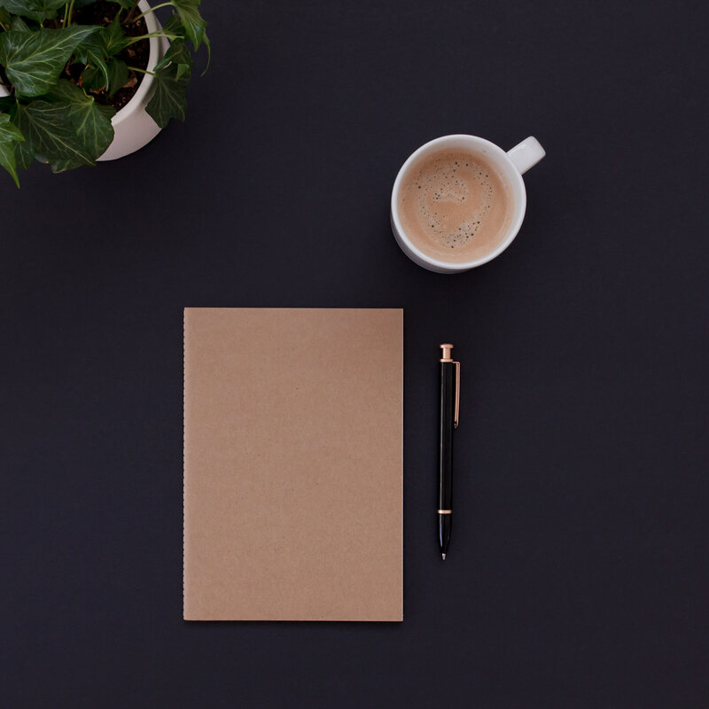 coffee and a note pad and pen