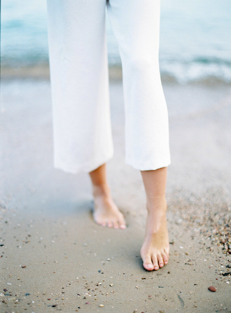 beach-wedding-white-jumpsuit-bare-feet-Stephanie-Brauer