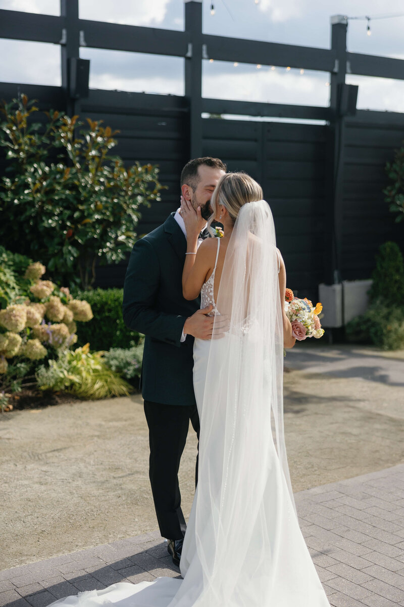 Bride and Groom Kissing Wedding Day