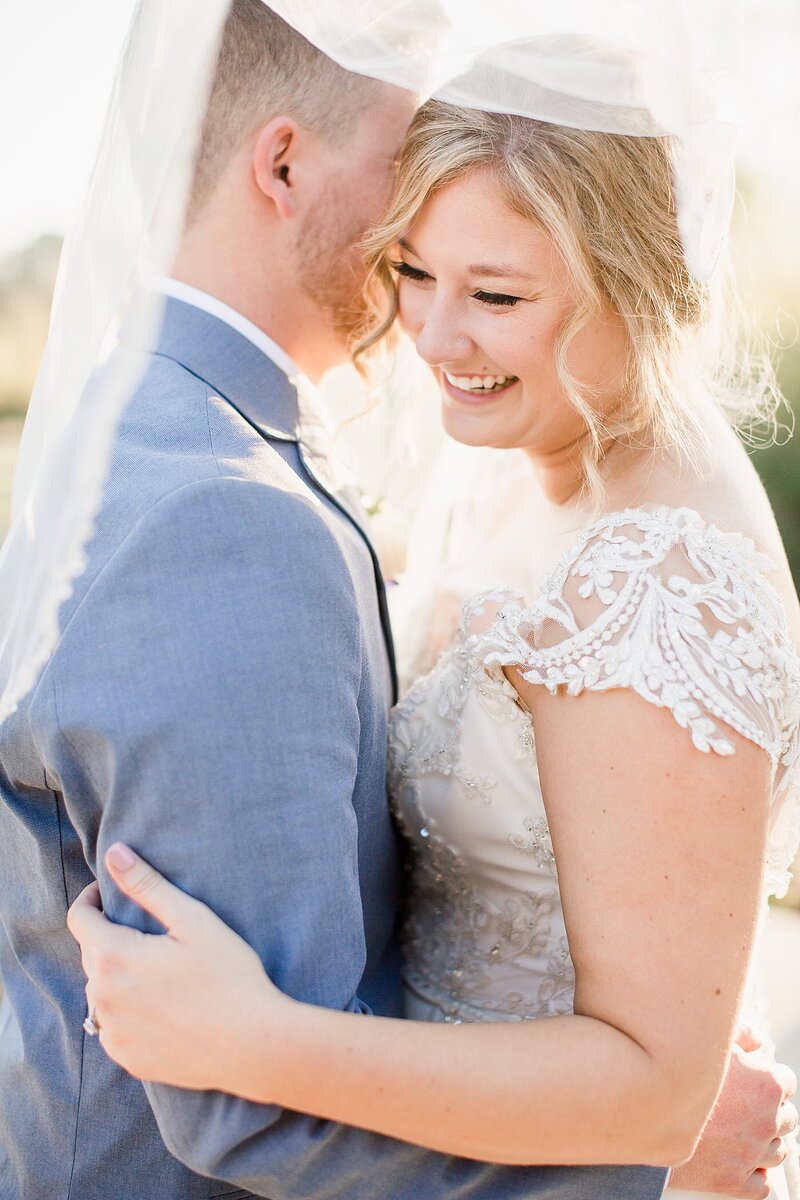 couple laughing by Knoxville Wedding Photographer, Amanda May Photos