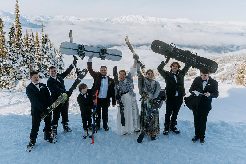 Whistler groom bends down to pet dog after Whistler wedding ceremony