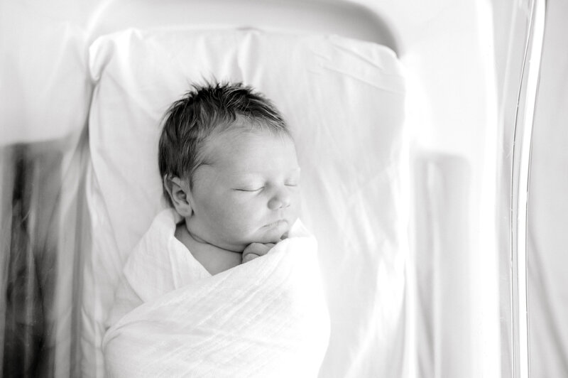 Black and white photo of sleeping newborn baby in Nashville hospital