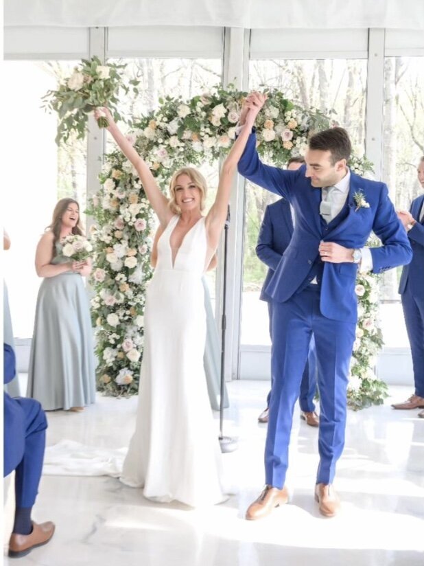 bride and groom just married under floral arch at the Monte Bello Estate in Lemont Illinois