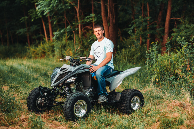 senior-guy-poses-wisconsin-rural-with-atv