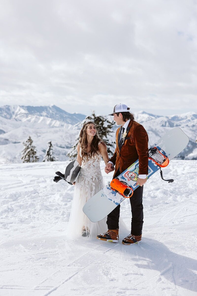 A couple looking into each others eyes laughing in the Sawtooth mountains in Stanley, Idaho