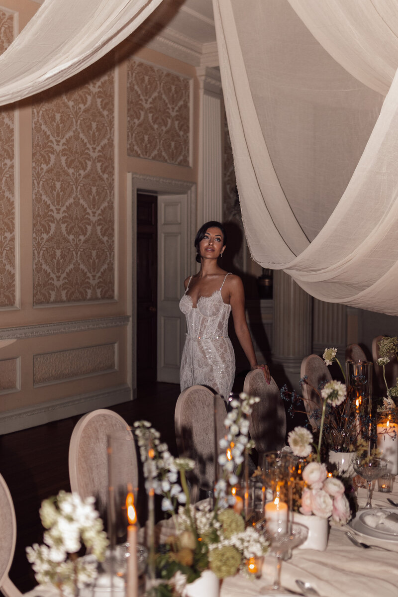 Wedding photographer captures couple taking a stroll hand in hand at their french chateau wedding.