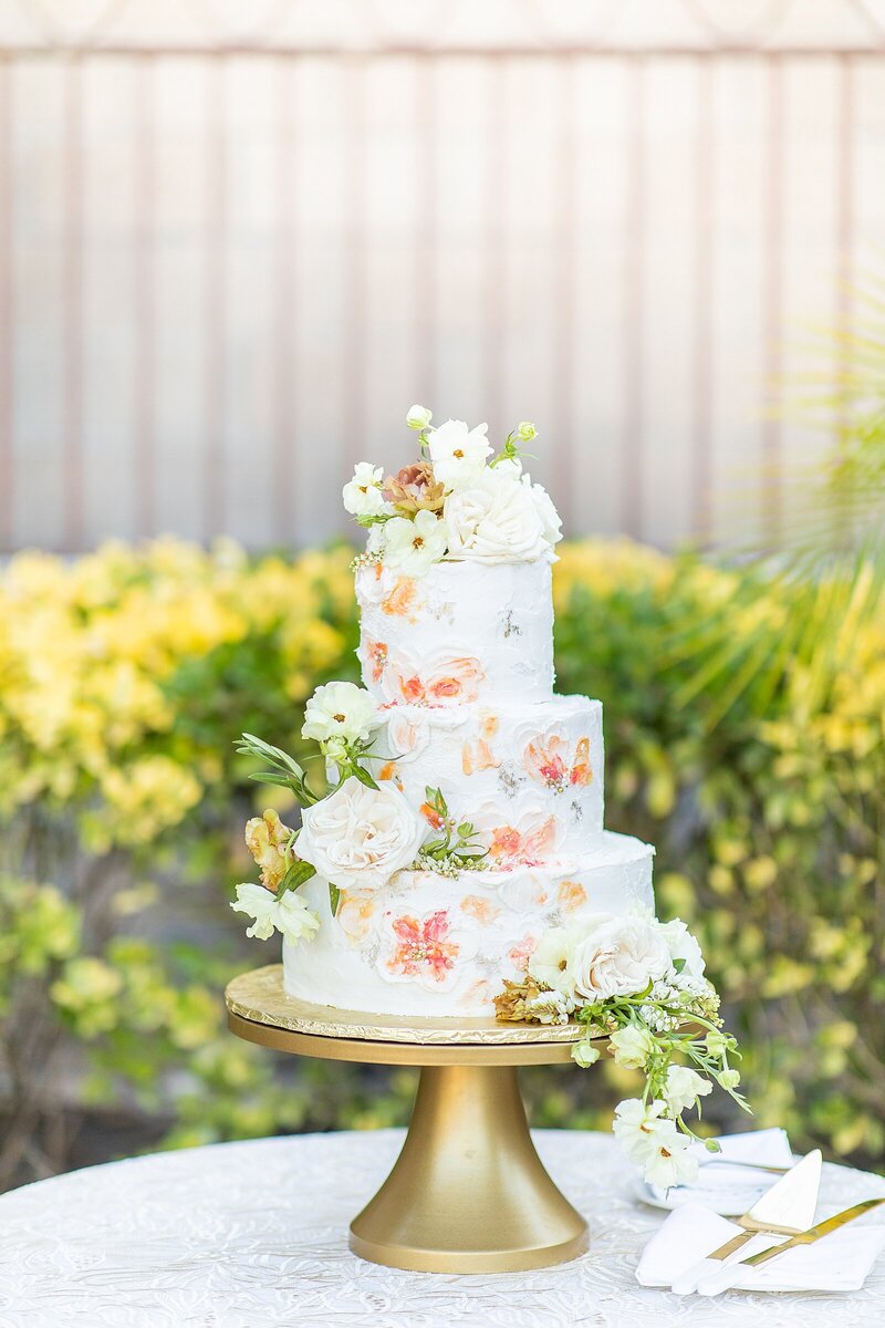 Floral painted wedding cake at South Coast Winery in Temecula, California.