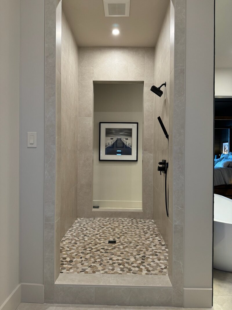 Custom shower with white and black tile.