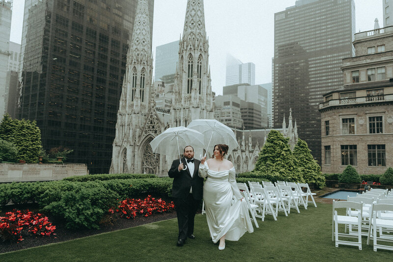bride and groom walking on rooftop during elopement shot by Elsie Goodman Photography | NYC Elopement Packages