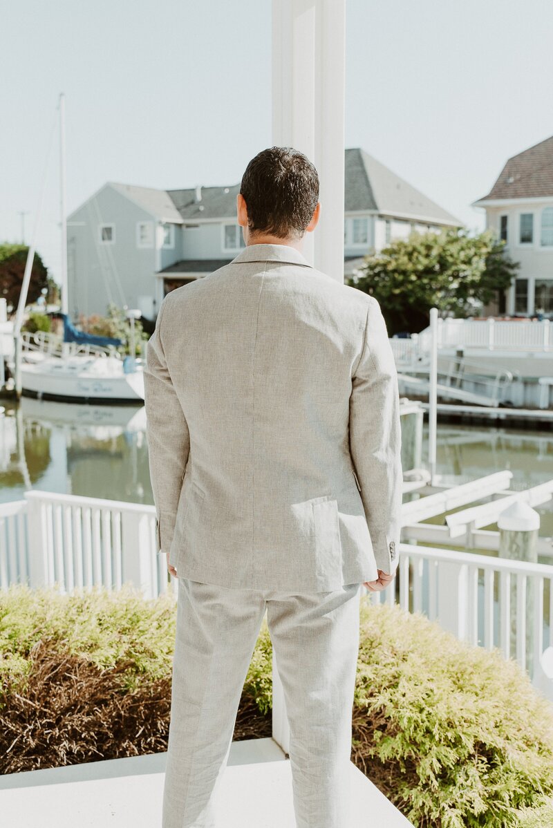 Groom waiting for first look at Malibu elopement