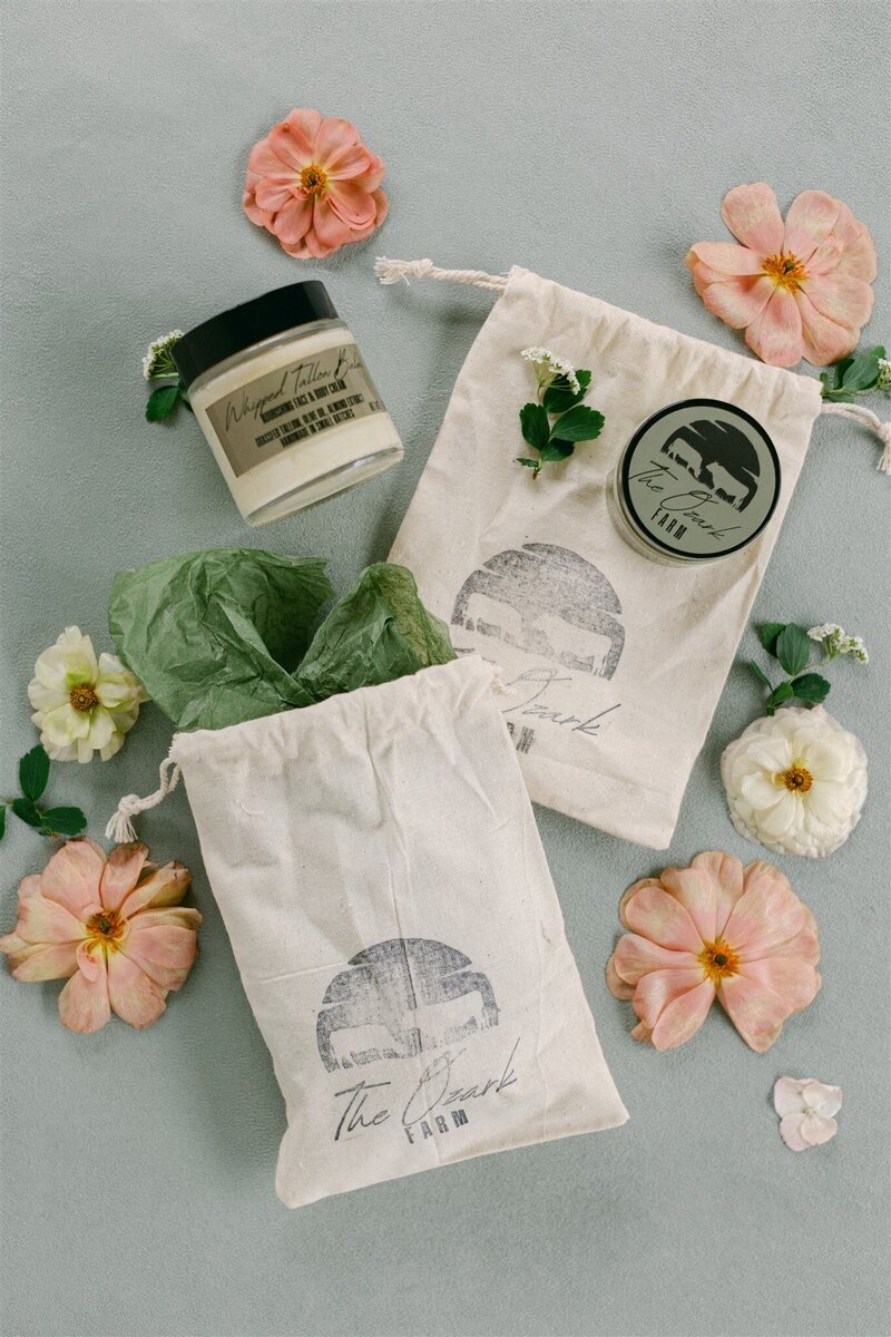 Sage suede styling mat with botanical details and vow books