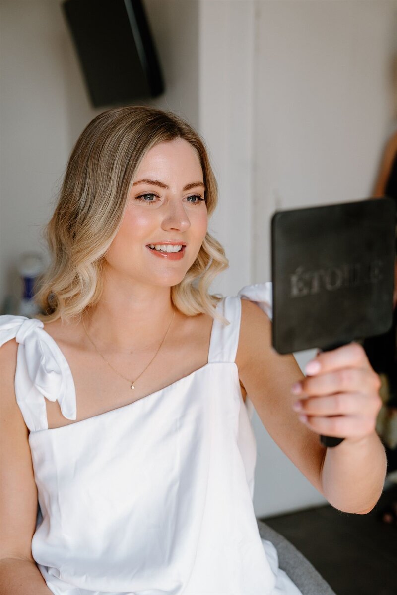 elegant bride in queenstown for wedding with hair and makeup sleek and natural