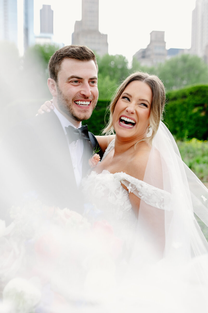 Two grooms embrace after taking their wedding vows