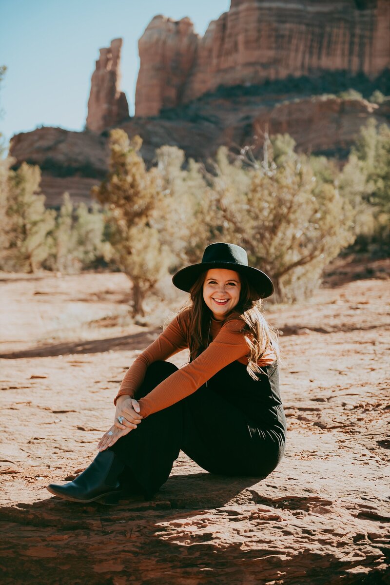 photographer sitting in sedona landscape