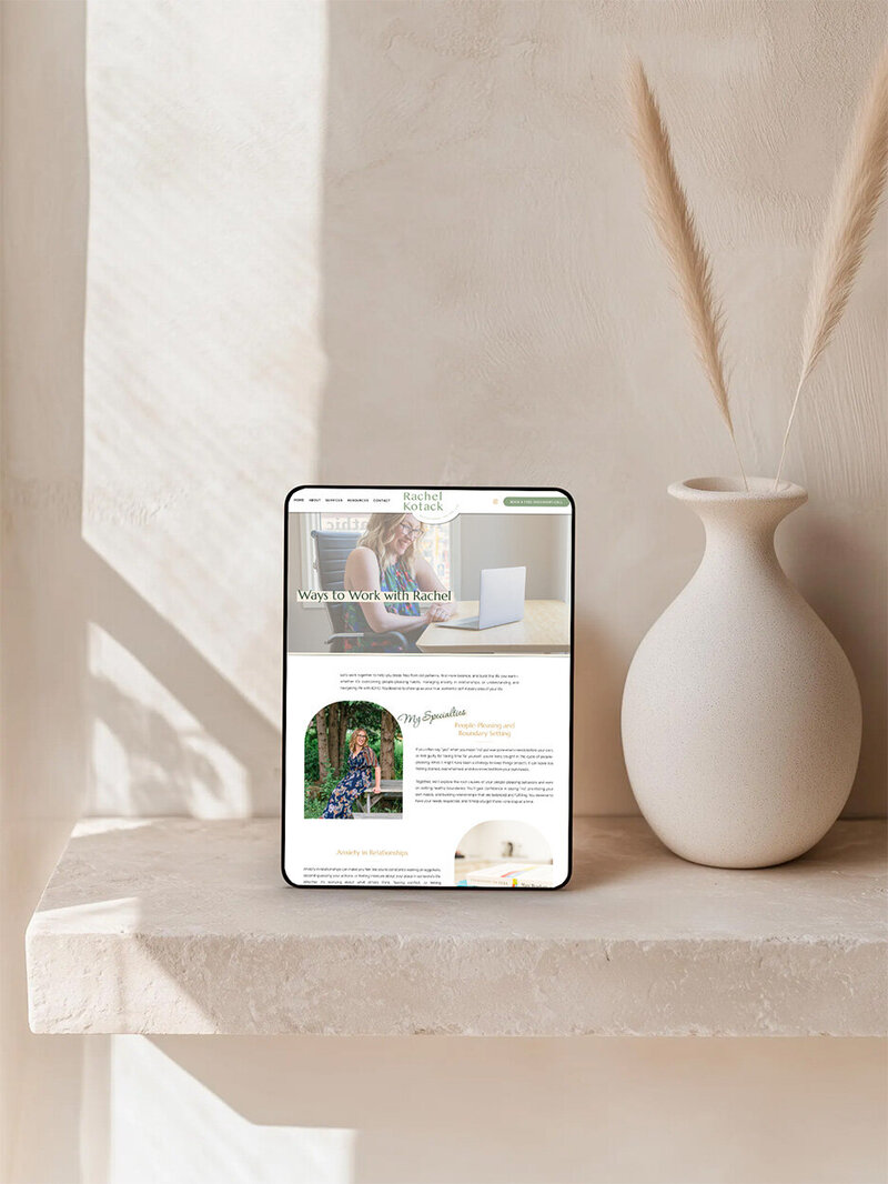 iPad sitting on a stone shelf showcasing a therapist's Serivces page
