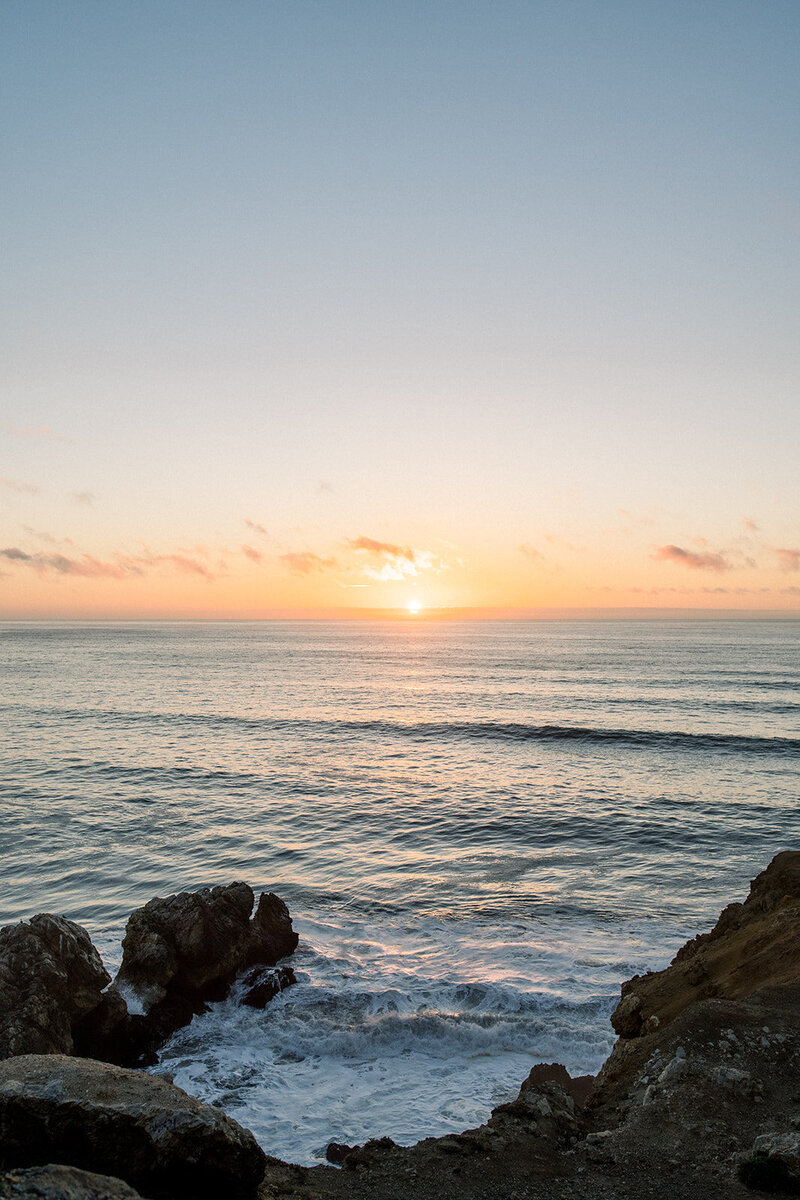A romantic engagement session on the sandy shores of Laguna Beach, California, photographed by Tiffany Longeway Photography.