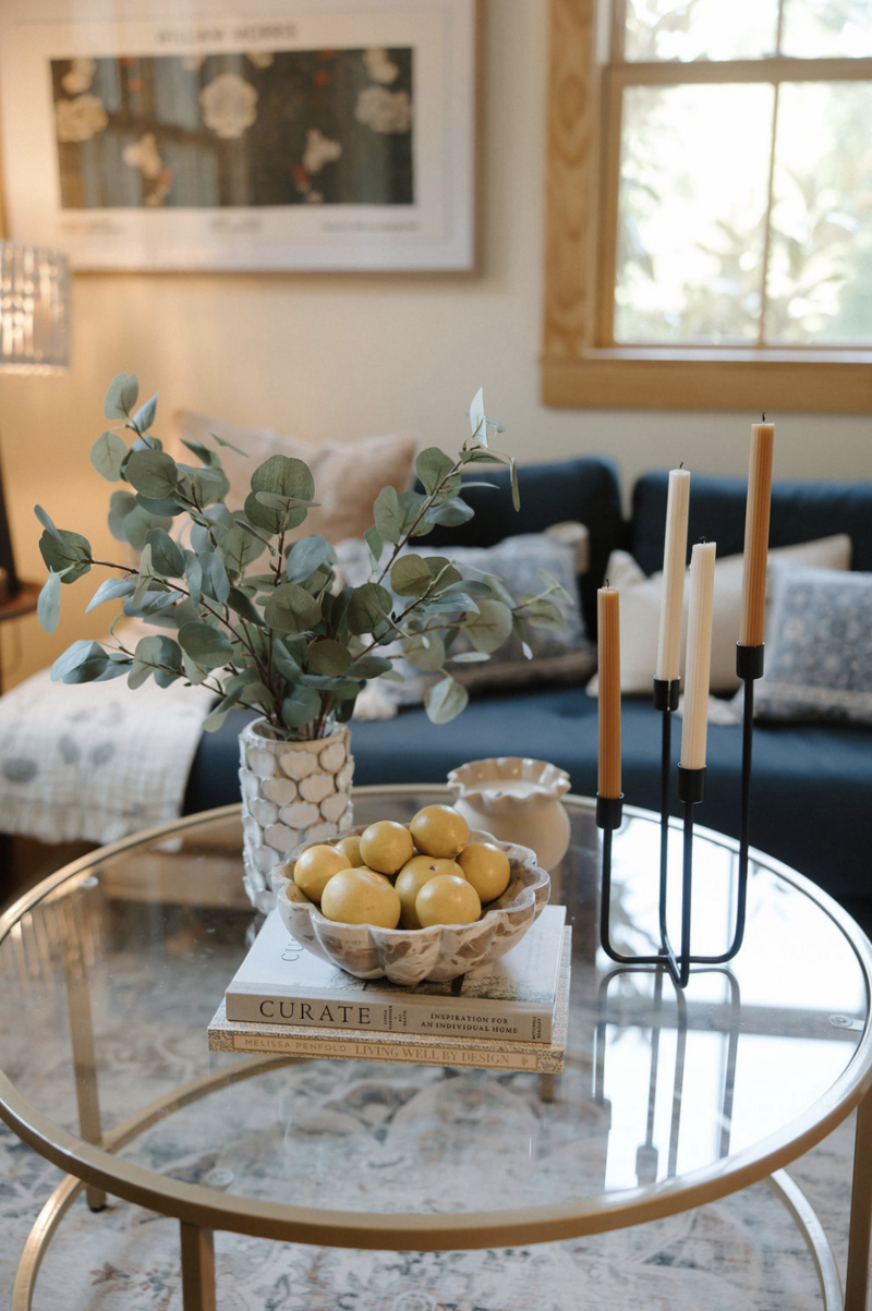 Interior space at Alyn Wellness studio with a couch and decorated table