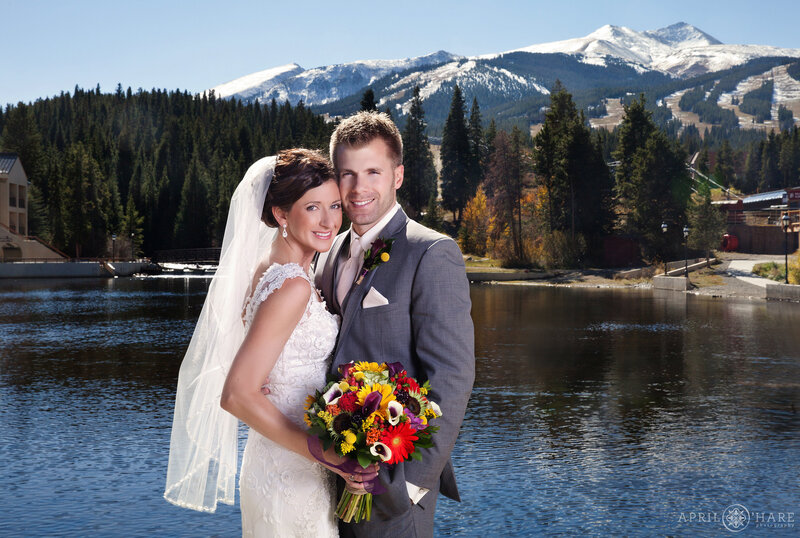 Wedding Couple Poses at Maggie Pond at The Maggie Wedding Venue in Breckenridge