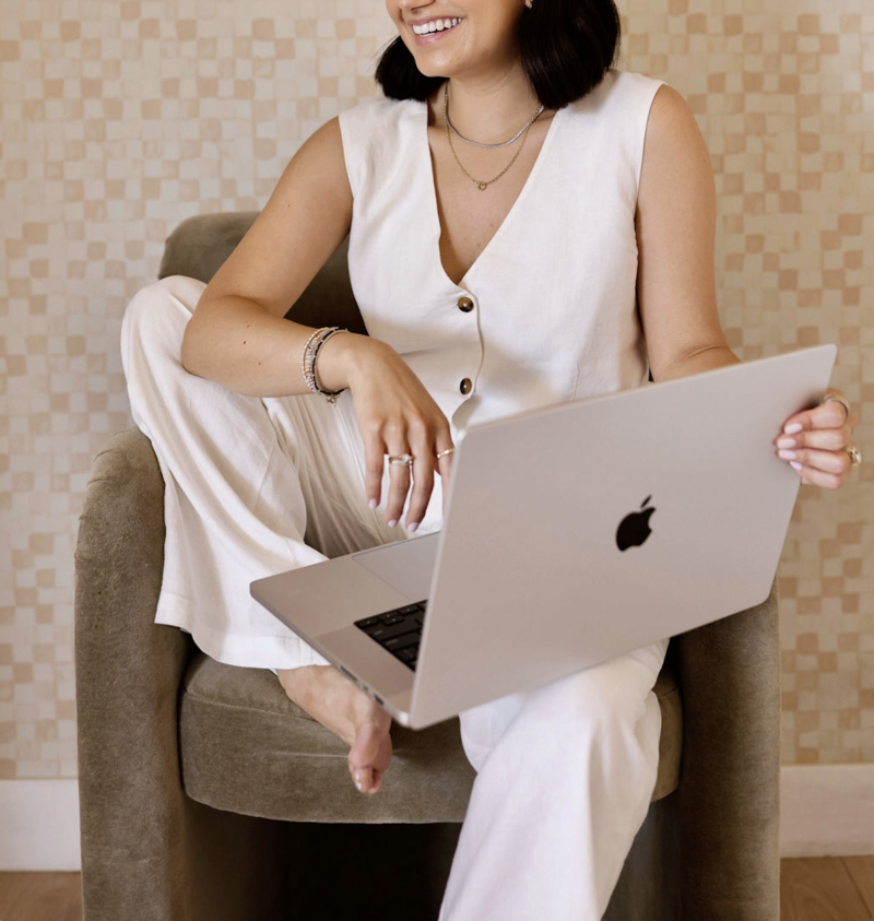 woman entrepreneur typing on laptop 
