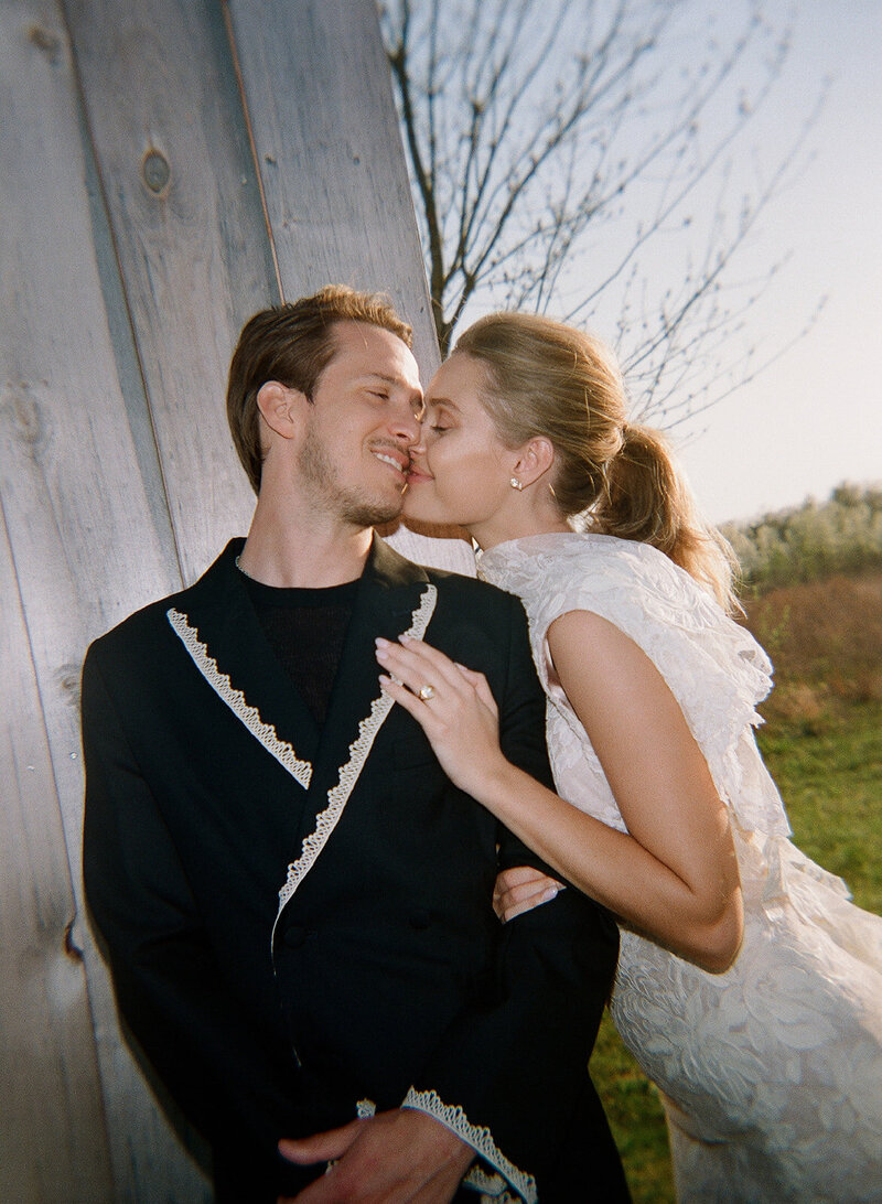 Bride in custom Vivienne Westwood at tented wedding in the mountains in Vermont 