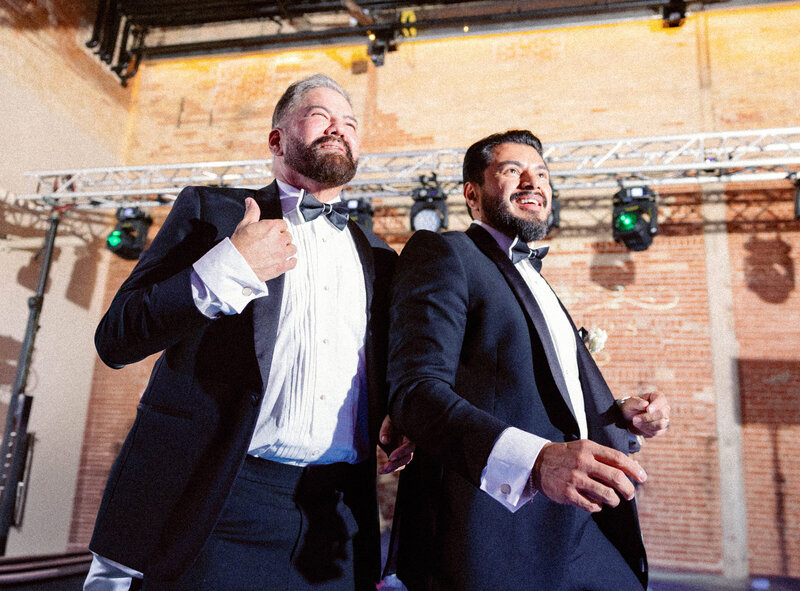 groom dancing with groomsmen