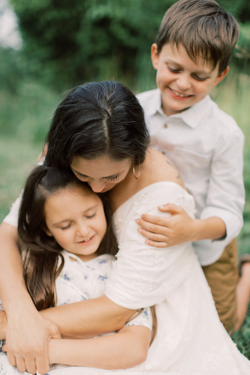 Philadelphia family photographer, Veronika Paluch, embraces her children