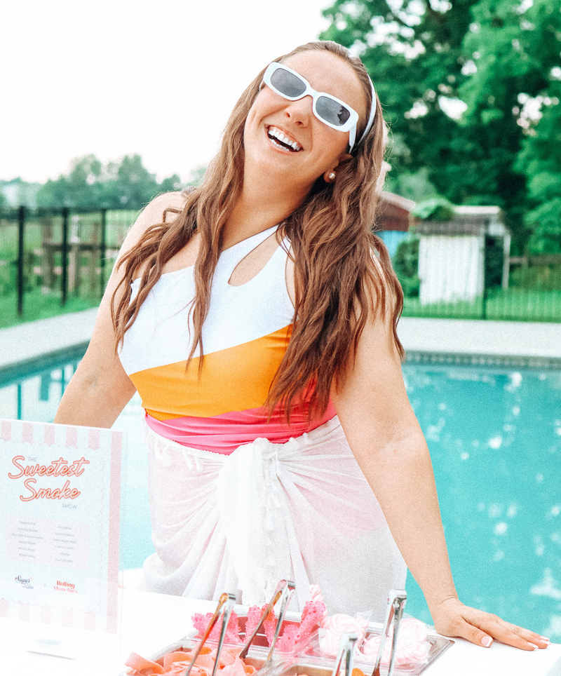 Allie smiling at the candy-filled snack cart in NJ summer setup