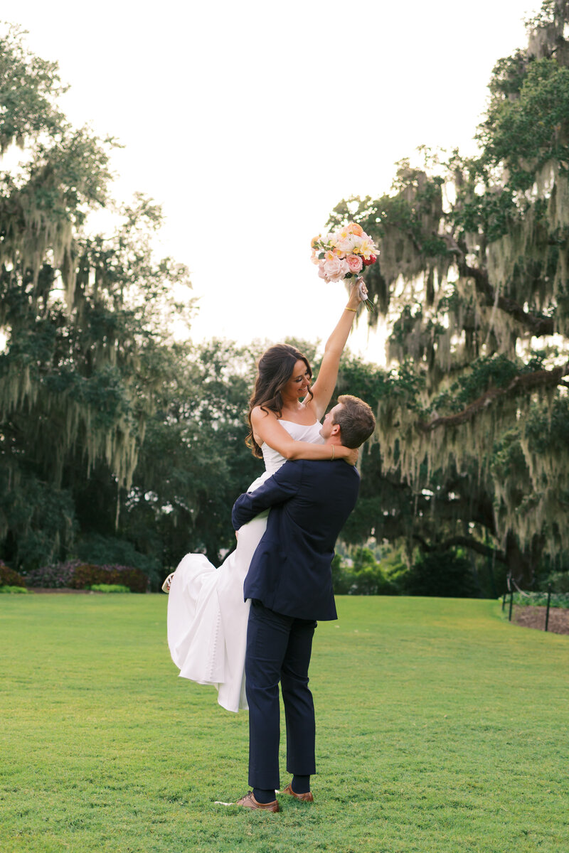 Momma snuggling her baby boy on Wrightsville Beach